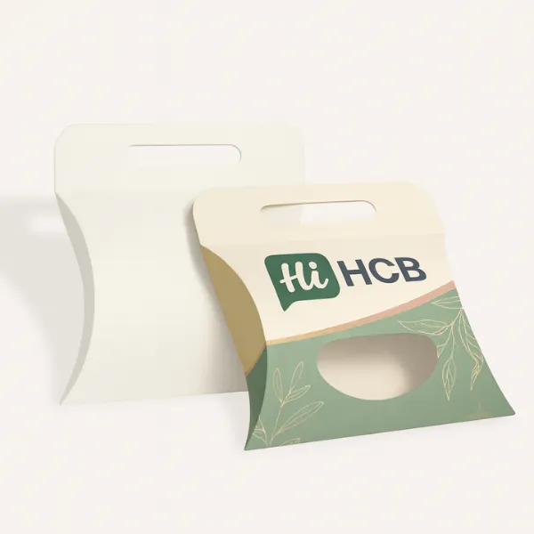 Plain white and decorative pillow boxes with a carry handle and oval viewing window- class=